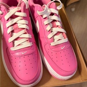 Nike Hot Pink Low-Top Sneakers with White Swoosh
Air Force 1